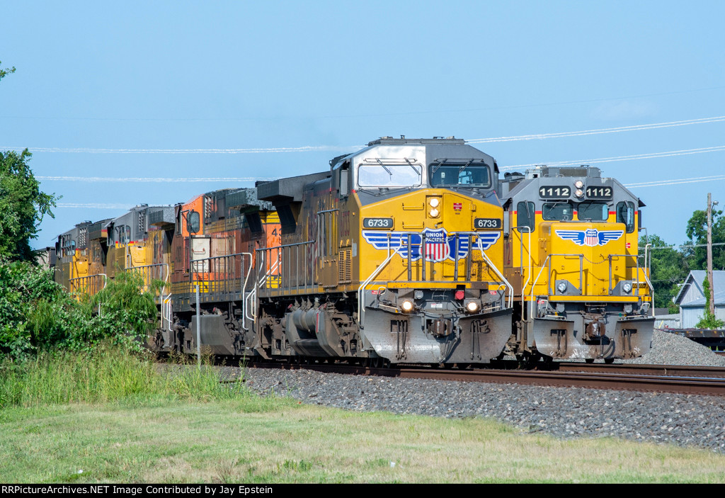 Two UP trains wait to head west at Rosenberg 